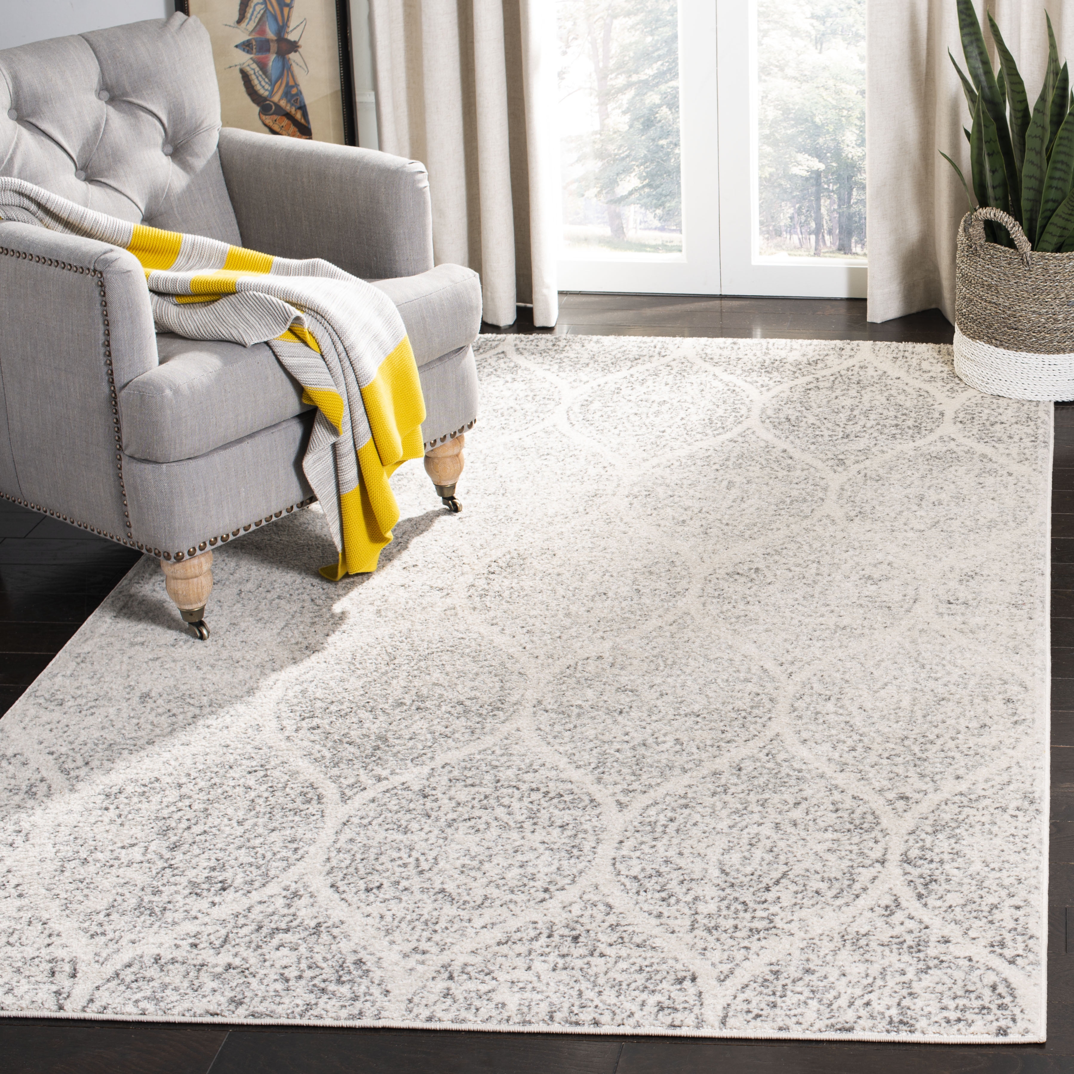 Elegant Ivory and Silver 9' x 12' Synthetic Easy-Care Area Rug