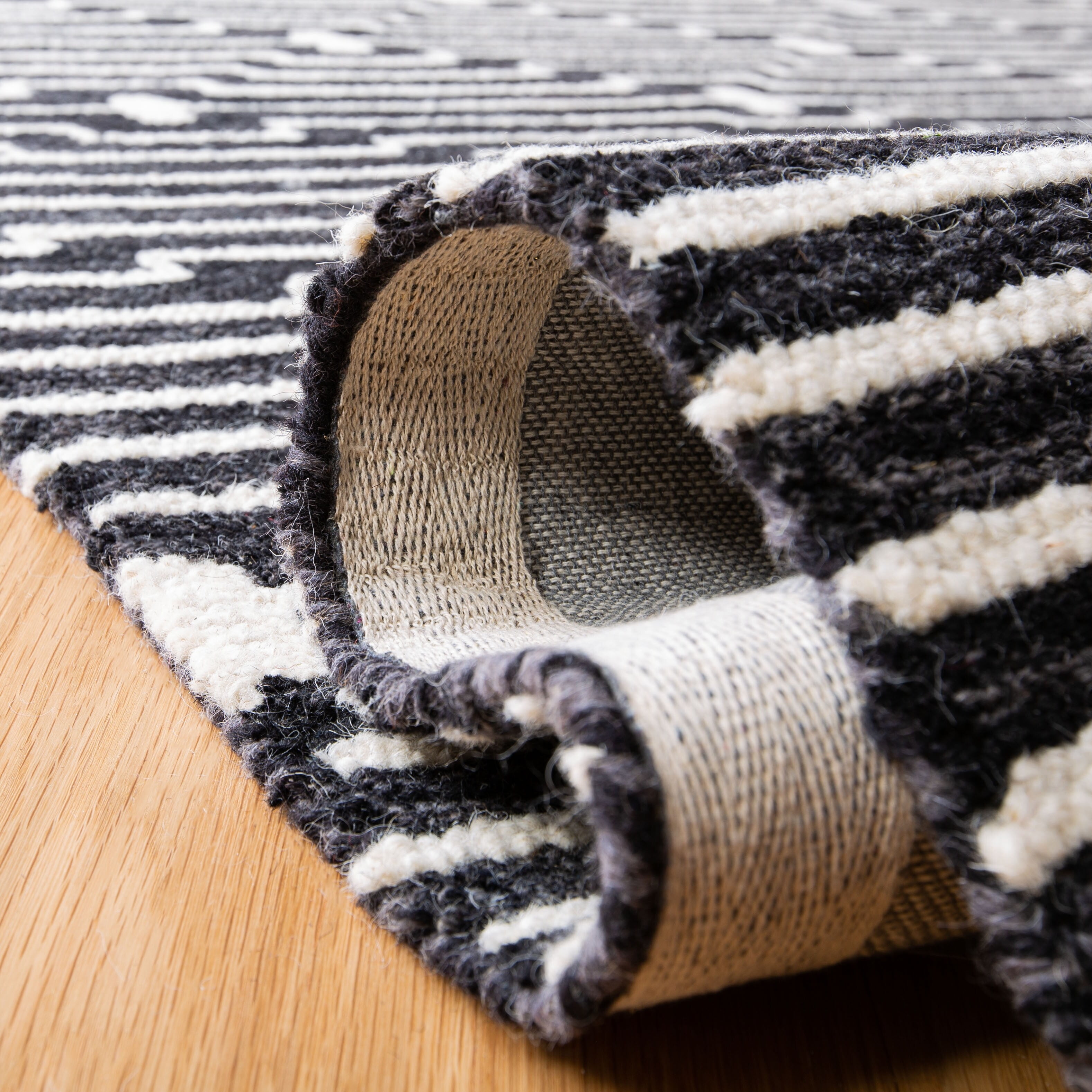 Ivory and Charcoal Round Tufted Wool Rug