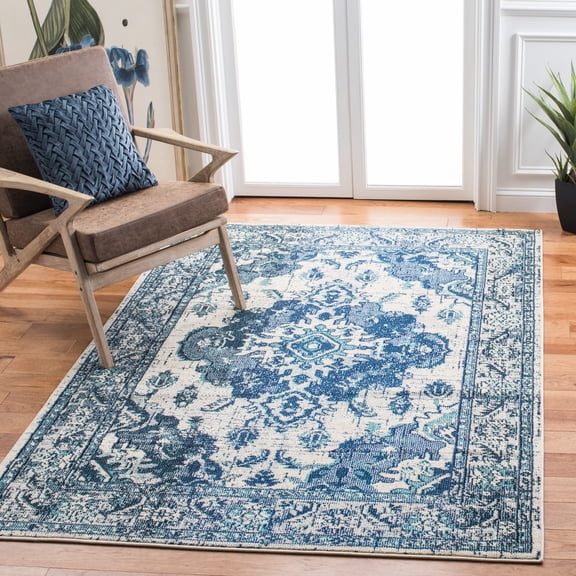 SAFAVIEH Monaco Toria Traditional Area Rug, Ivory/Blue, 6'7" X 9'2" - Traditional Design, Ivory & Blue, Ideal for Living Room, Bedroom, Dining Space