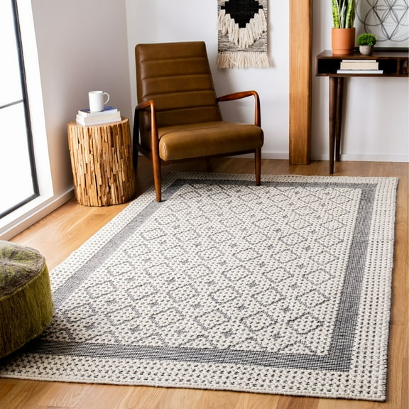 SAFAVIEH Natura Loew Solid Bordered Area Rug, Cream/Black, 5' x 8'