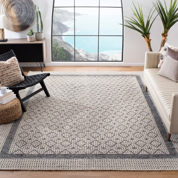 SAFAVIEH Natura Loew Solid Bordered Area Rug, Cream/Black, 9' x 12'