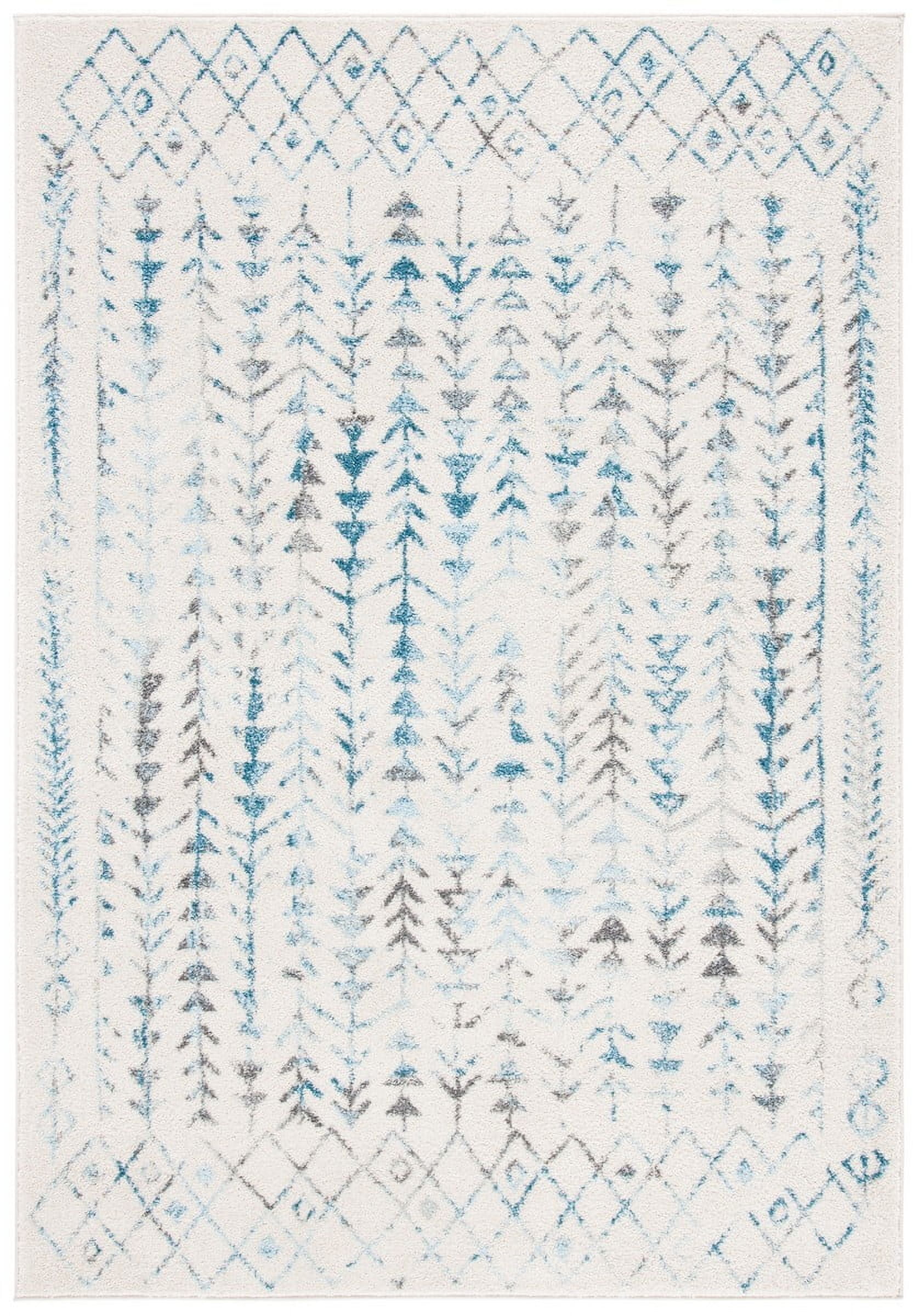 Ivory and Turquoise 6' x 9' Synthetic Area Rug