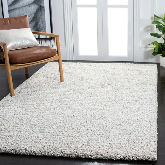 SAFAVIEH Ultimate Atanas Solid Plush Polyester Shag Area Rug, Sand/Ivory, 4' x 6'