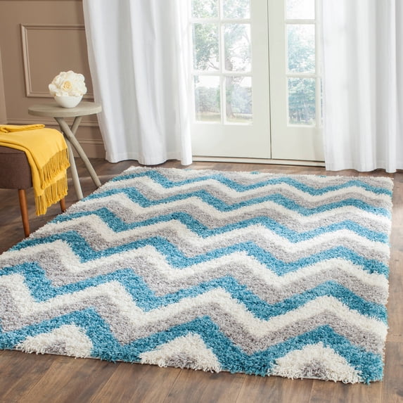 SAFAVIEH Willis Zigzag Stripes Kids Shag Area Rug, Ivory/Blue, 5'3" x 7'6"