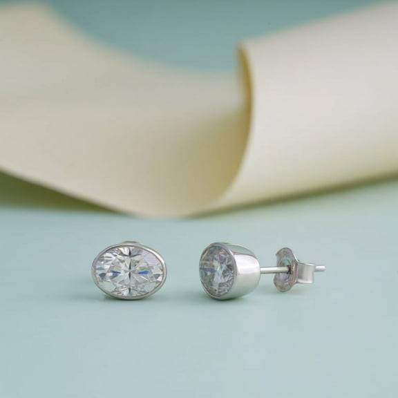 SOLITAIRE JEWELS 1TCW Oval Moissanite/Diamond Pointer Stud Bezel Earrings In 925 Silver Sterling