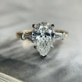 thumbnail image 1 of SOLITAIRE JEWELS 2.9ct Pear Cut Three Stone Side Tapered Baguette Moissanite Engagement Ring 10K Two Tone Gold, 1 of 4