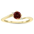 thumbnail image 1 of SZUL Women's Round Shaped Garnet and Diamond Wave Ring in 10K Yellow Gold, 1 of 5