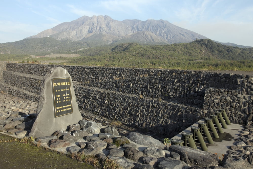 Sabo channel at Haramatsu River with tubular grid dam and Sakurajima volcano Japan Canvas Art - Richard RoscoeStocktrek Images (18 x 12)