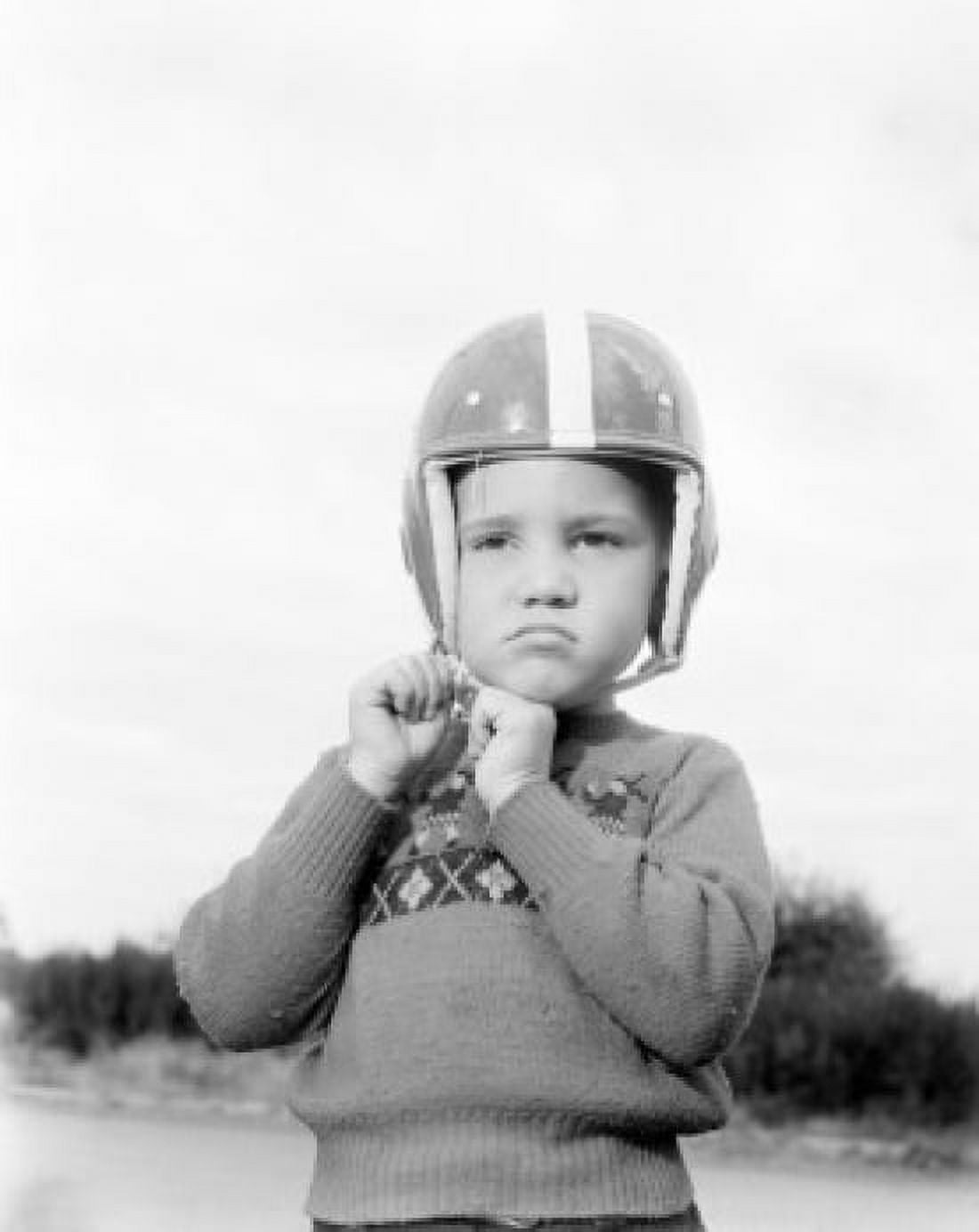 Sad boy wearing helmet Canvas Art - (24 x 36)