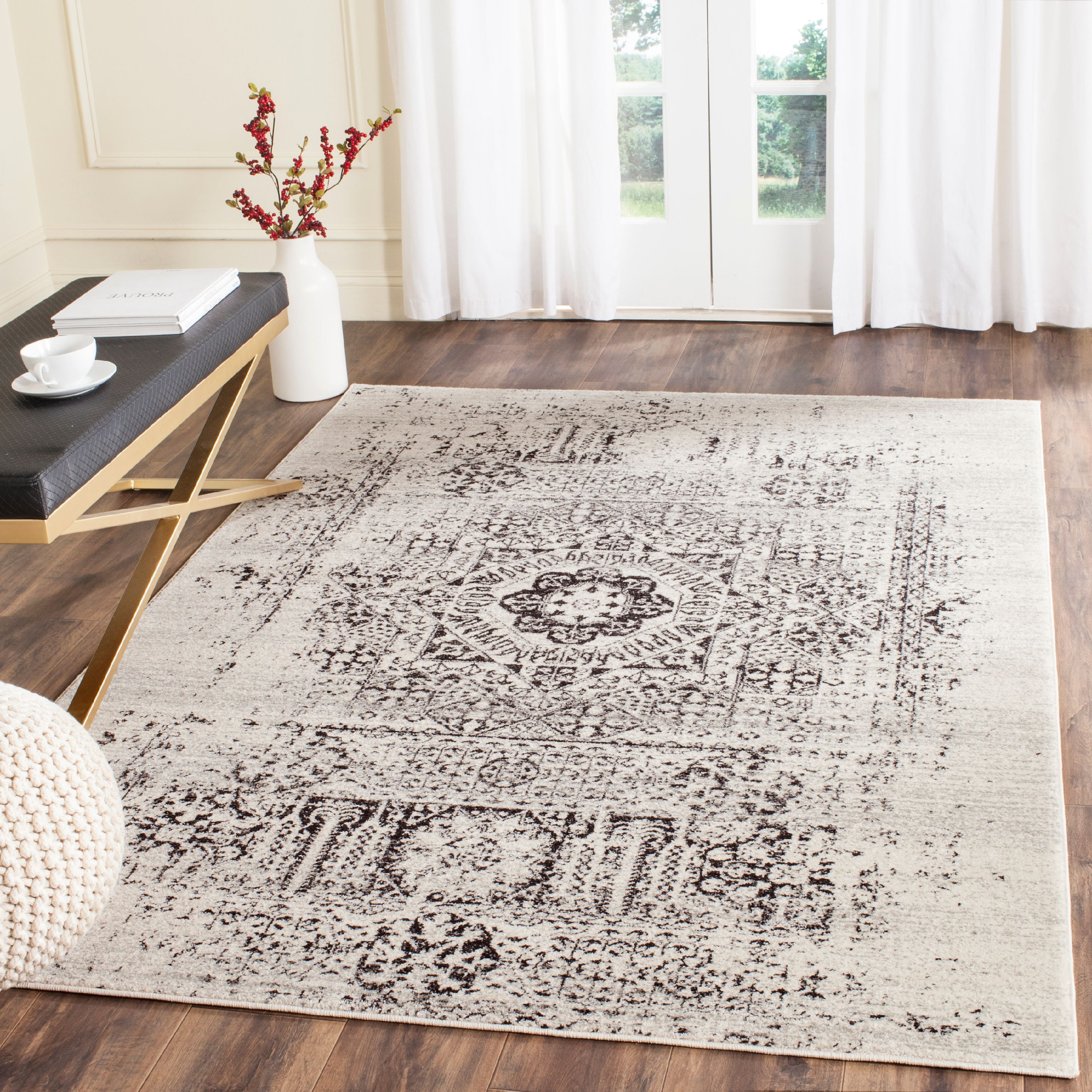Ivory and Black Floral Motif Synthetic Area Rug