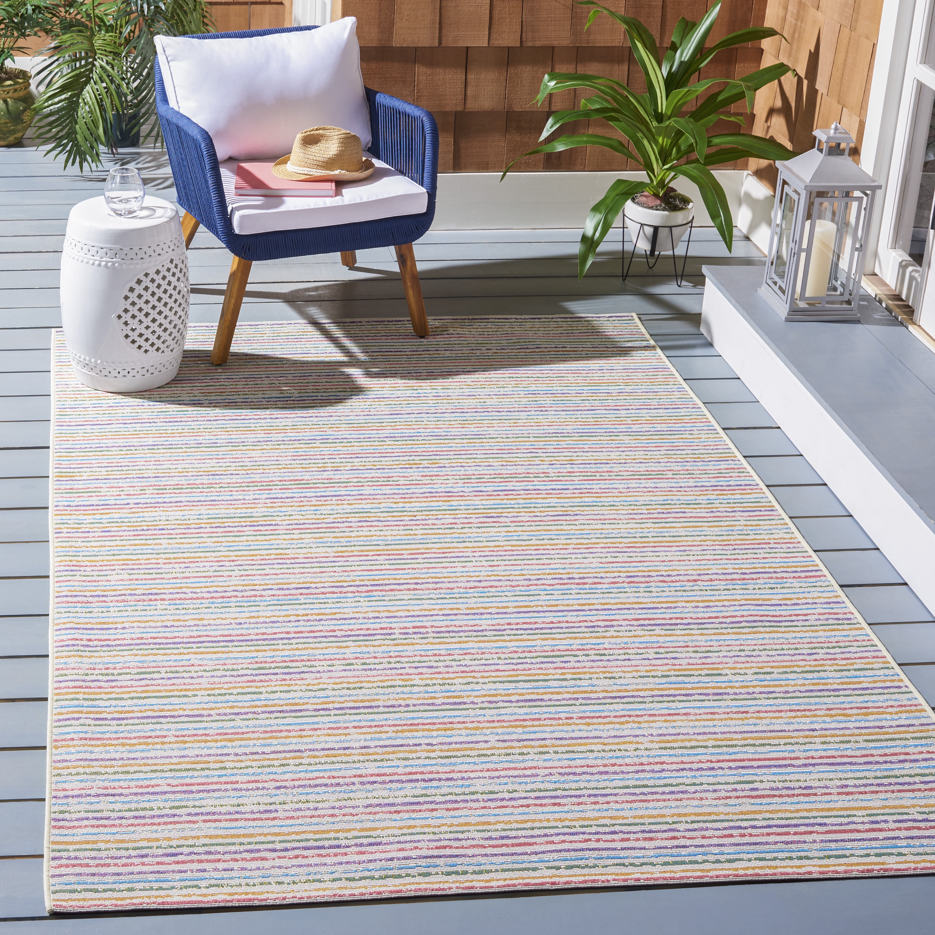 Ivory and Blue Synthetic 4' x 6' Easy-Care Outdoor Rug
