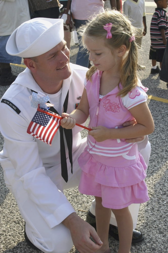 Sailor greets his daughter during homecoming Canvas Art - Stocktrek Images (23 x 34)