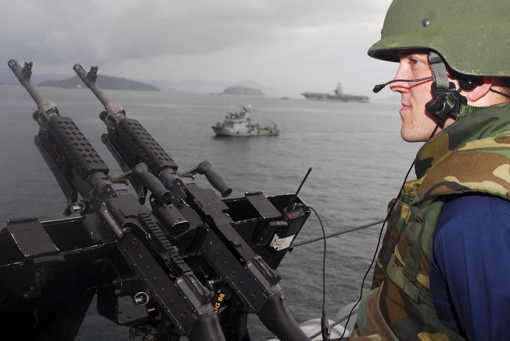 Sailor mans a 50-caliber machine gun aboard USS Preble Canvas Art - Stocktrek Images (35 x 24)