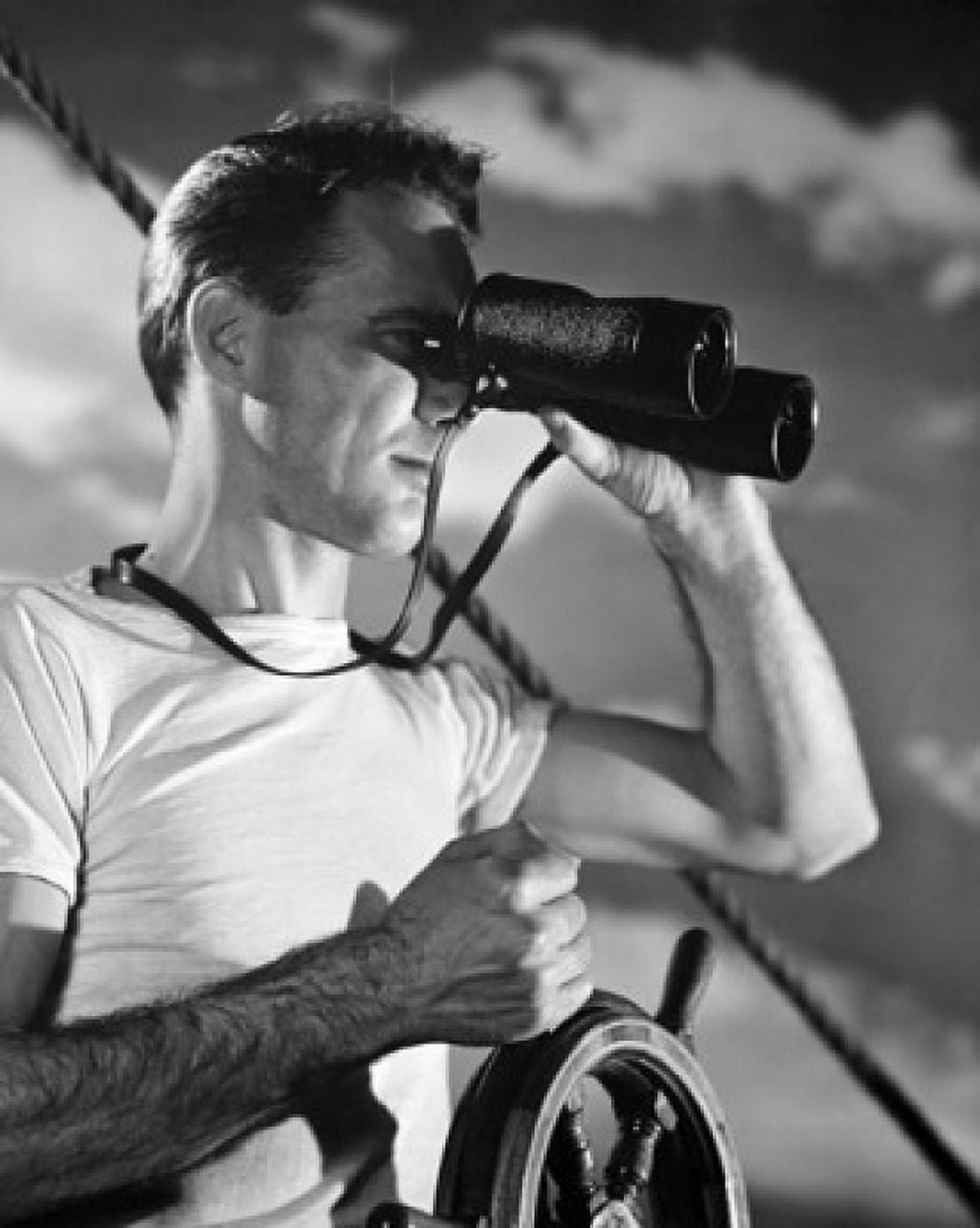 Sailor steering a boat and looking through a pair of binoculars Canvas Art - (24 x 36)