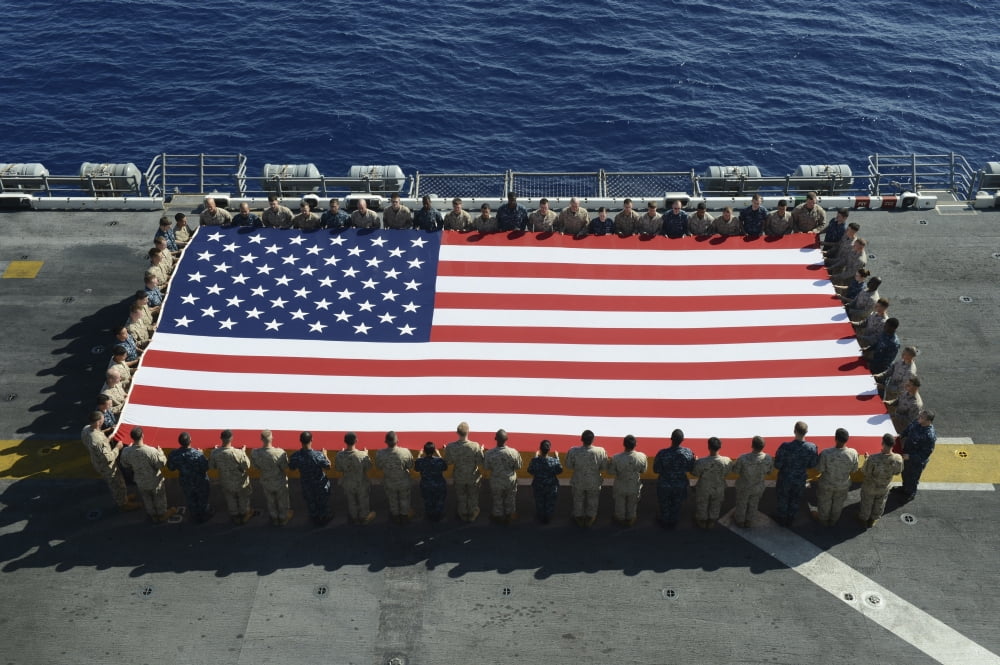 Sailors and Marines display the national ensign aboard USS Kearsarge Canvas Art - Stocktrek Images (35 x 23)