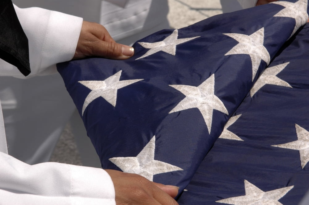 Sailors assigned to the colors detail fold the national ensign Canvas Art - Stocktrek Images (34 x 23)