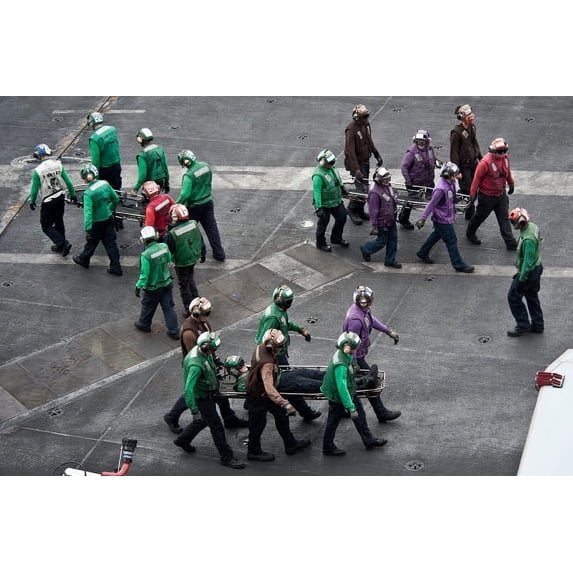 Sailors carry stretchers in response to a mass casualty drill Poster Print by Stocktrek Images (17 x 11)