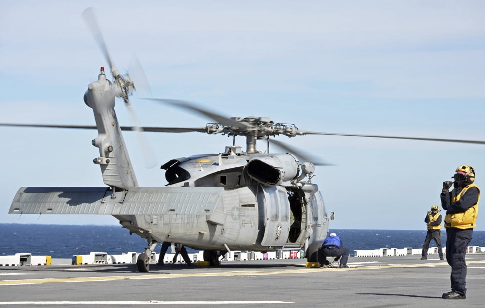 Sailors chock and chain an MH-60S Sea Hawk helicopter Canvas Art - Stocktrek Images (35 x 23)