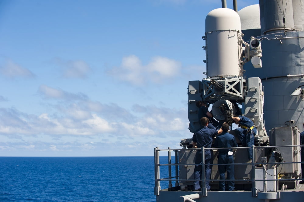 Sailors conduct maintenance on a Close-in Weapon System aboard USS Cowpens Canvas Art - Stocktrek Images (35 x 23)