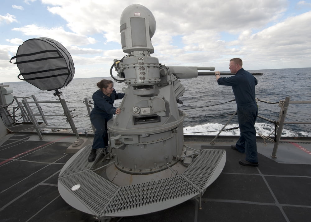 Sailors conduct maintenance on the MK38 MOD-2 25mm machine gun system Canvas Art - Stocktrek Images (33 x 24)