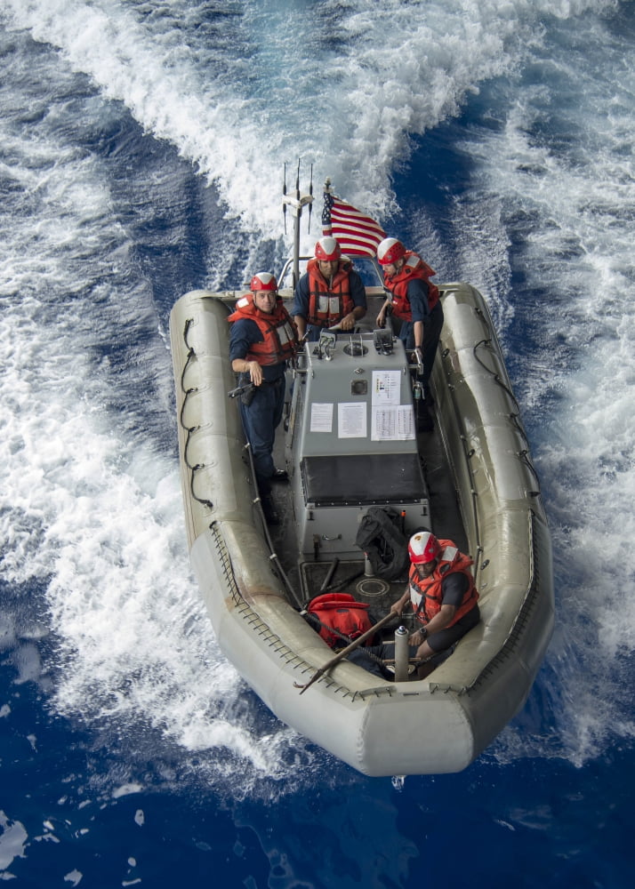 Sailors conduct man overboard training in a small boat Canvas Art - Stocktrek Images (24 x 33)