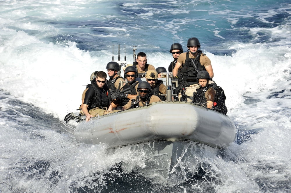 Sailors conduct maneuvers in a rigid-hull inflatable boat Canvas Art - Stocktrek Images (35 x 23)