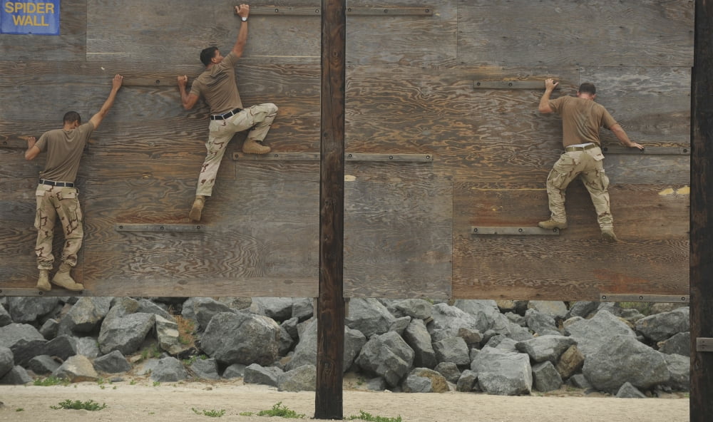 Sailors crawl across narrow planks of wood as part of an obstacle course Canvas Art - Stocktrek Images (37 x 22)