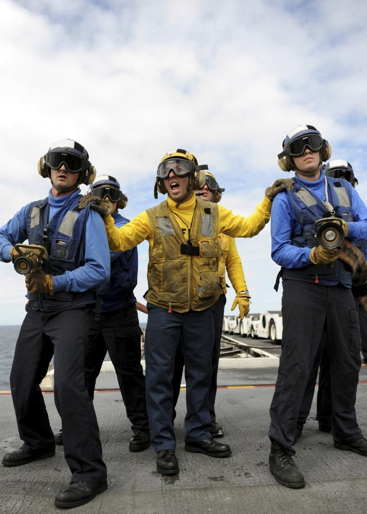 Sailors fight a simulated fire aboard the aircraft carrier USS Abraham Lincoln Canvas Art - Stocktrek Images (24 x 34)