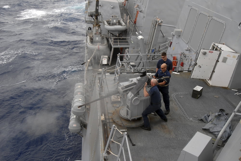 Sailors fire a Mark 38 machine gun board guided missile destroyer USS Nitze Canvas Art - Stocktrek Images (34 x 23)