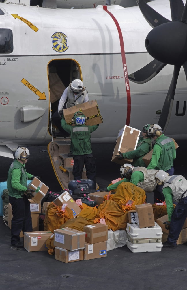 Sailors load mail on to a C-2A Greyhound Canvas Art - Stocktrek Images (23 x 35)