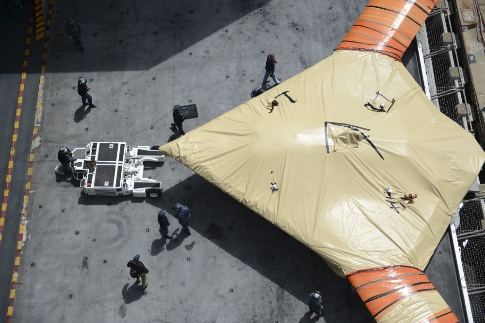 Sailors move an X-47B Unmanned Combat Air System Canvas Art - Stocktrek Images (35 x 23)