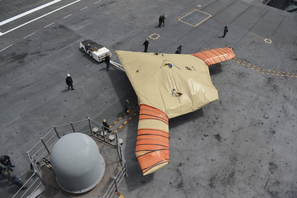 Sailors move an X-47B Unmanned Combat Air System Canvas Art - Stocktrek Images (35 x 23)