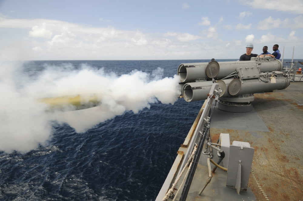 Sailors observe a MK-46 recoverable exercise torpedo launch aboard USS Mitscher Canvas Art - Stocktrek Images (35 x 23)