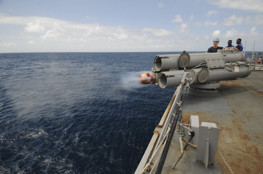 Sailors observe a MK-46 recoverable exercise torpedo launch aboard USS Mitscher Canvas Art - Stocktrek Images (35 x 23)