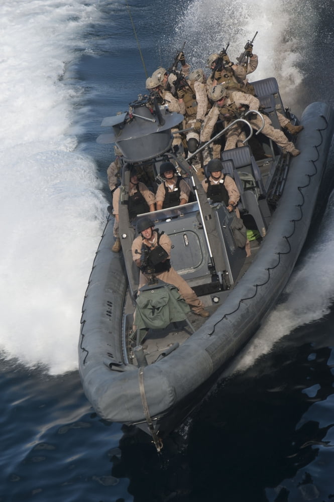Sailors operate a rigid-hull inflatable boat Canvas Art - Stocktrek Images (23 x 35)