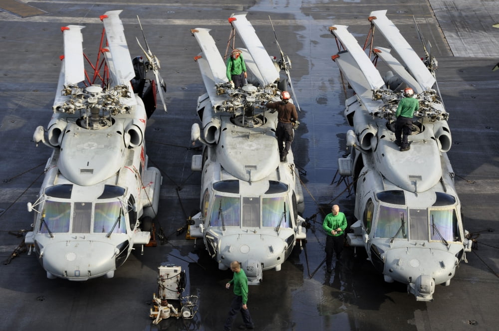 Sailors perform maintenance on MH-60S Sea Hawk helicopters Canvas Art - Stocktrek Images (35 x 23)