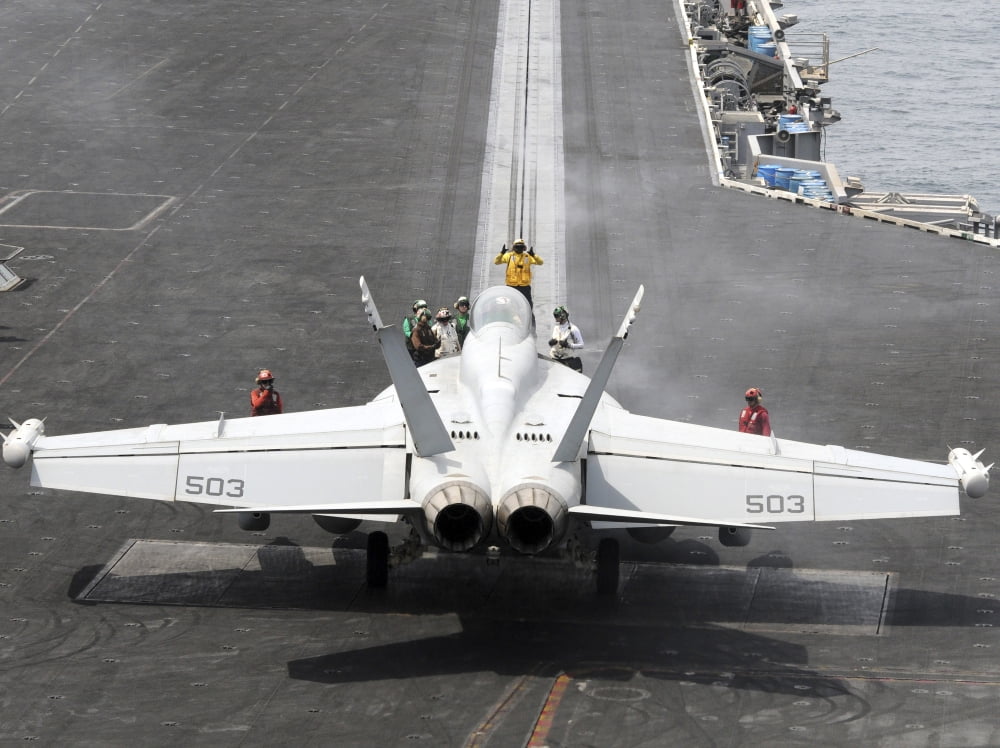 Sailors perform pre-launch checks on an EA-18G Growler Canvas Art - Stocktrek Images (33 x 25)
