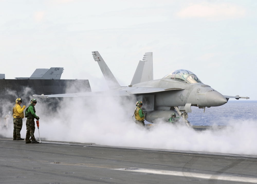 Sailors prepare an FA-18F Super Hornet for launch aboard USS George Washington Canvas Art - Stocktrek Images (34 x 24)