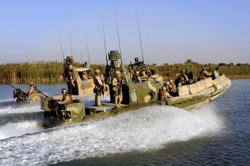 Sailors racing along the Euphrates River in riverine patrol boats in Iraq Canvas Art - Stocktrek Images (35 x 23)