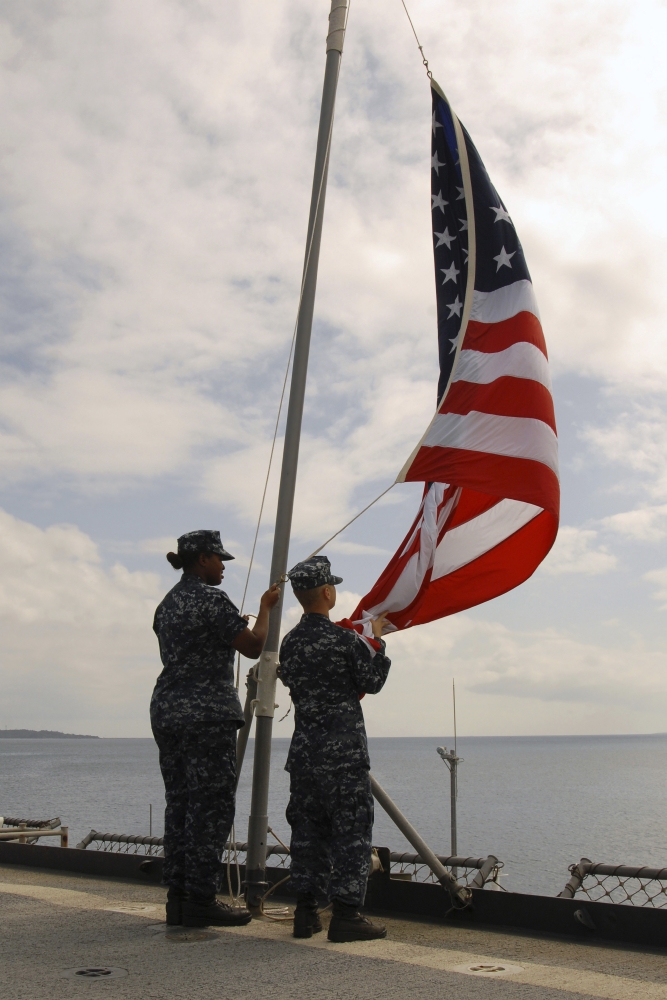 Sailors raise the American Flag aboard USS Tortuga Canvas Art - Stocktrek Images (23 x 35)