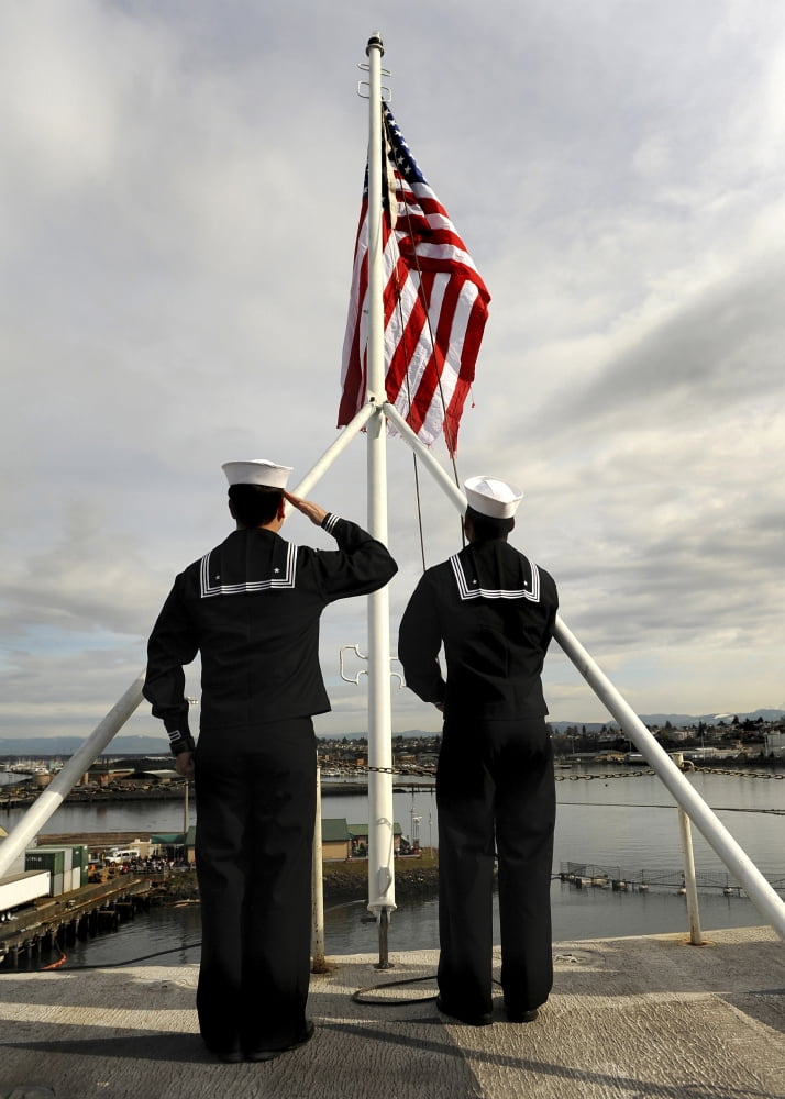 Sailors raise the national ensign aboard USS Abraham Lincoln Canvas Art - Stocktrek Images (24 x 34)