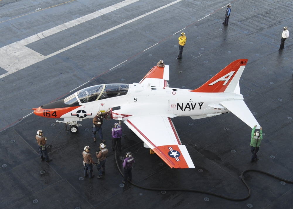 Sailors refuel a T-45 Goshawk on the flight deck of USS George HW Bush Canvas Art - Stocktrek Images (33 x 24)