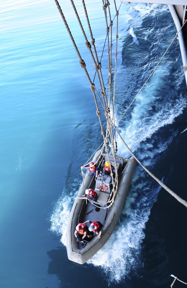 Sailors release lines from a rigid hull inflatable boat Canvas Art - Stocktrek Images (23 x 35)