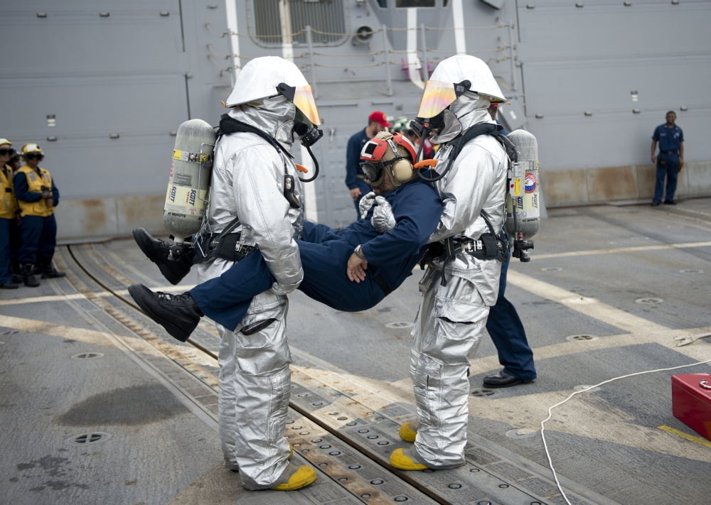 Sailors simulate rescuing a pilot during a crash and salvage drill Canvas Art - Stocktrek Images (34 x 24)