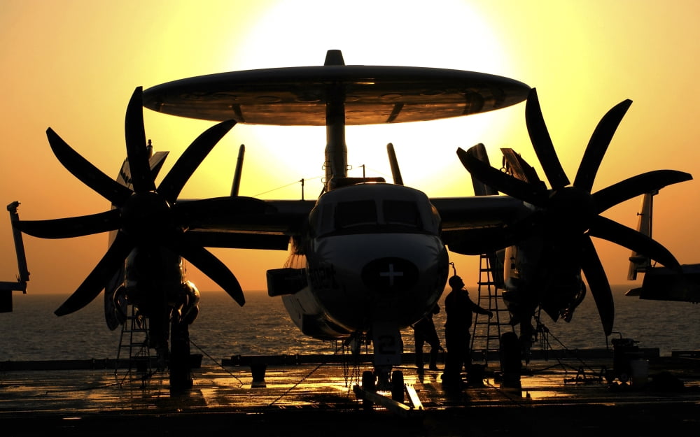 Sailors work on an E-2C Hawkeye aircraft aboard USS Abraham Lincoln Canvas Art - Stocktrek Images (36 x 22)