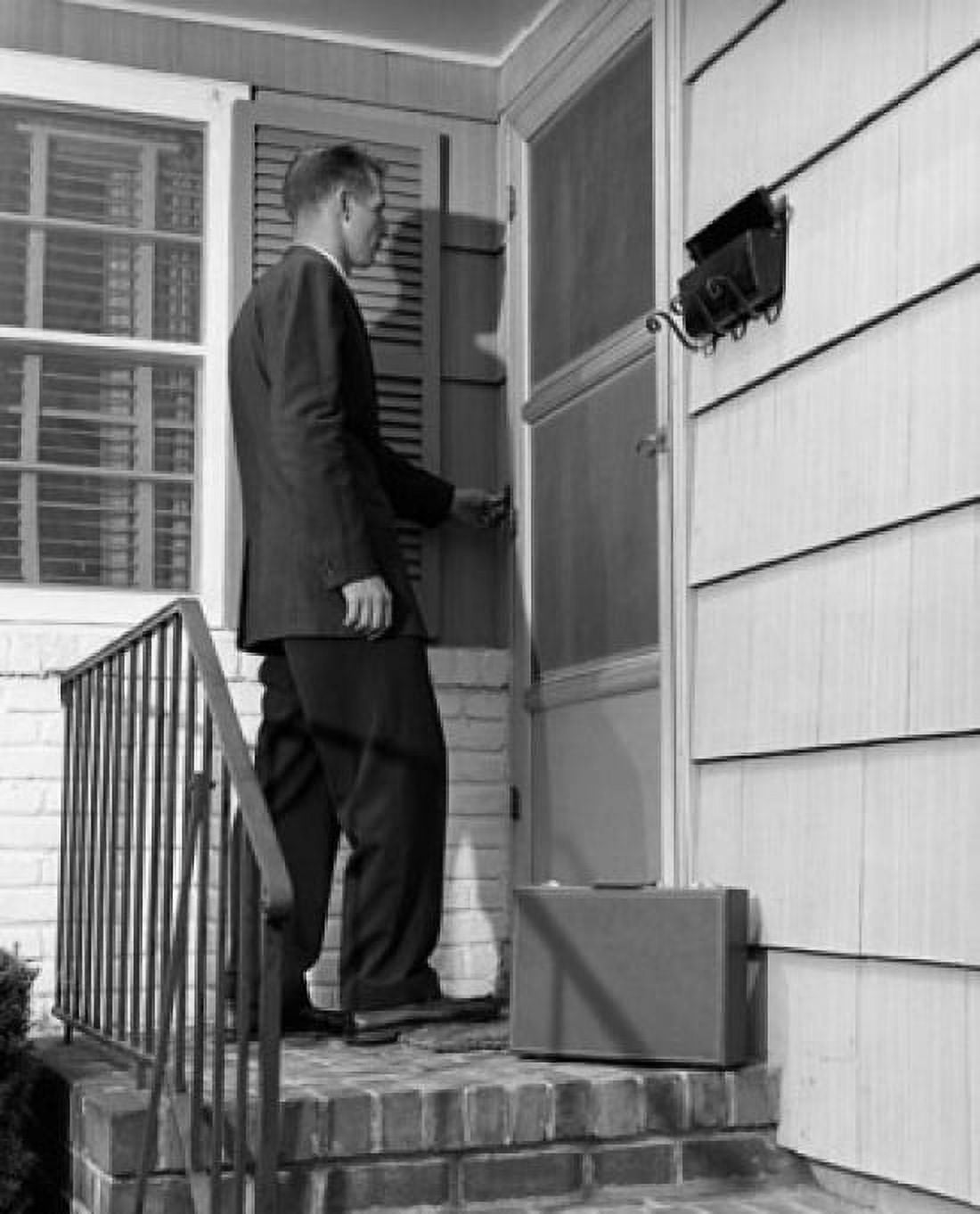 Salesman ringing the doorbell of a house Canvas Art - (18 x 24)