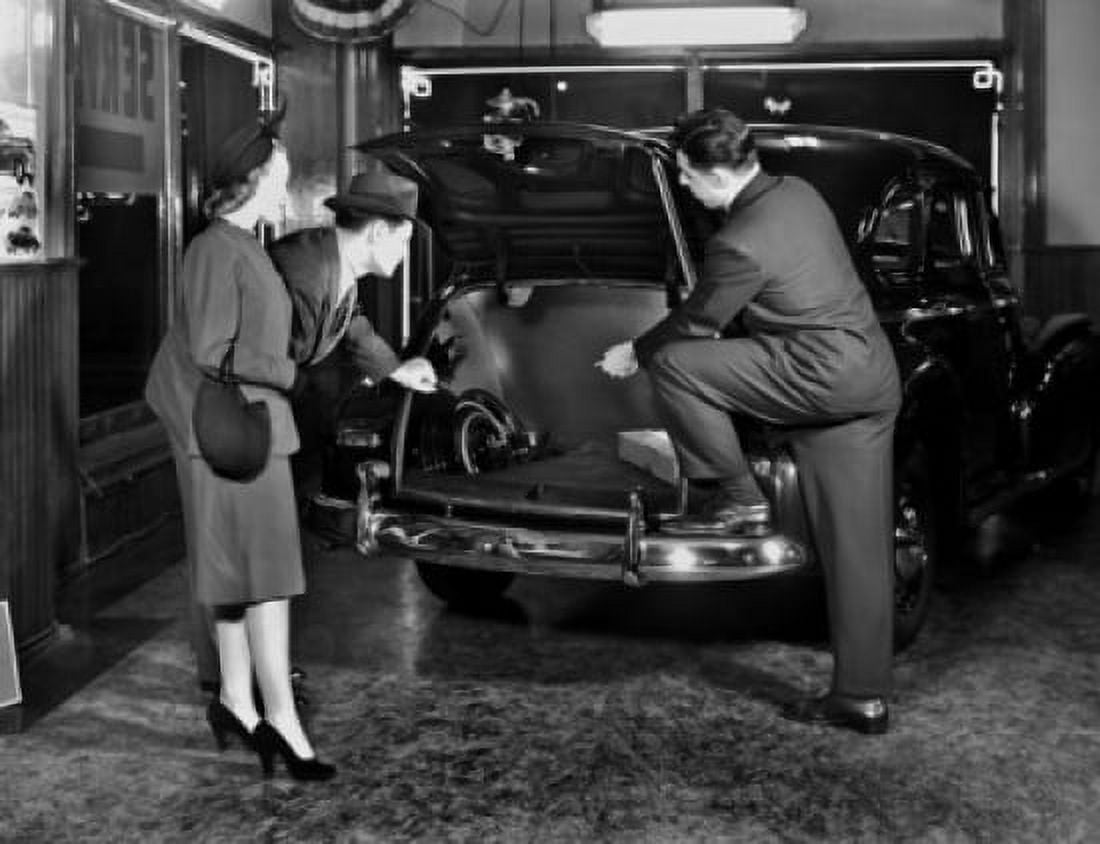 Salesman showing car to customers Canvas Art - (18 x 24)