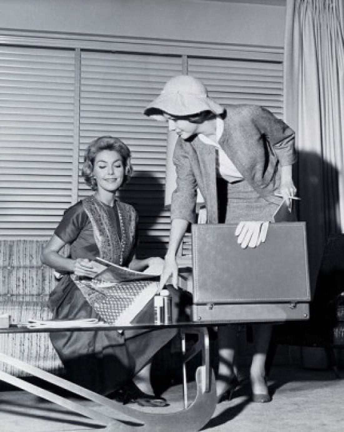 Saleswoman showing products to a young woman Canvas Art - (24 x 36)
