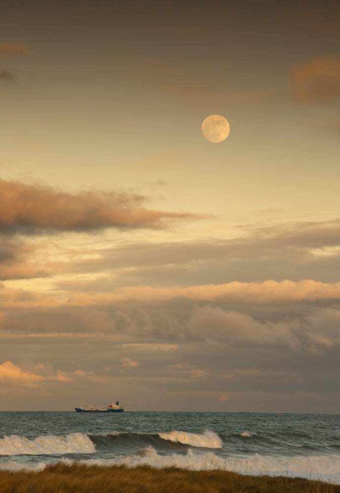 Saltburn Teesside England A Cargo Ship Traveling On The Ocean With The Moon In The Sky Canvas Art - John Short Design Pics (12 x 18)