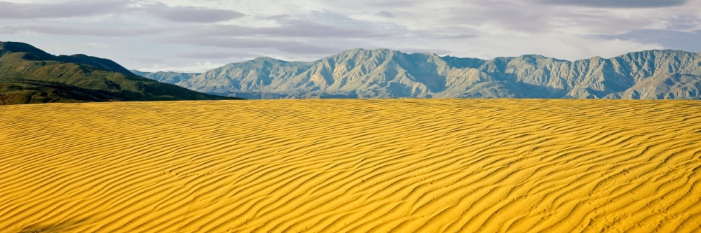 Sand dunes in a desert with a mountain range in the background Santa Rosa Mountains Anza Borrego Desert State Park California USA Canvas Art - Panoramic Images (12 x 36)